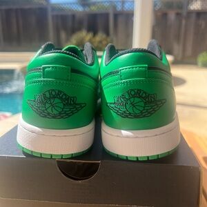 Green and black Jordan 1 lows